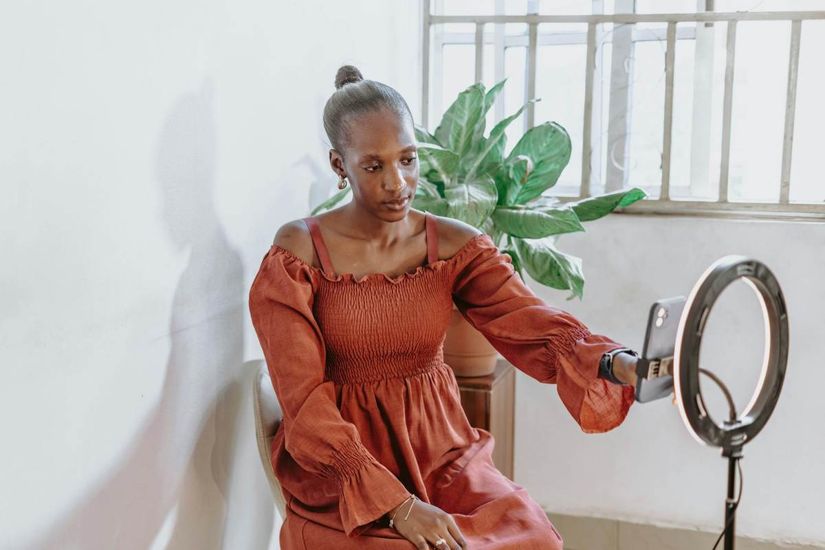 Content creator building audience on laptop and phone