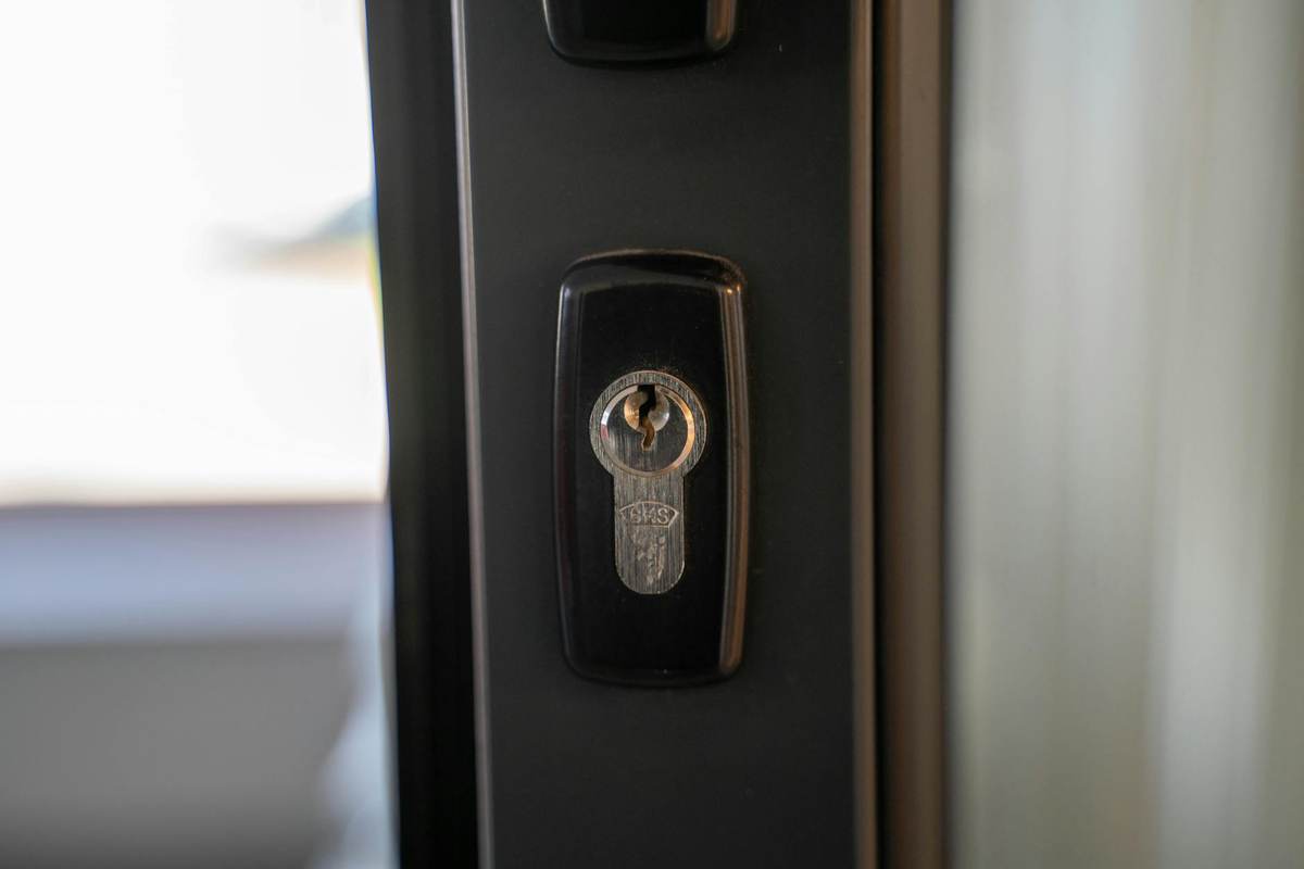 Locked door with light shining through keyhole representing paid community content teasing strategy