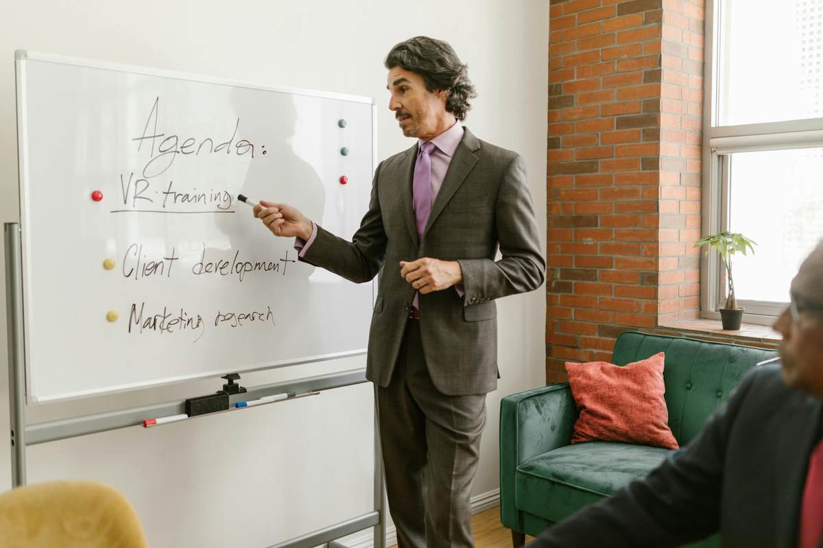 Creator planning a challenge pricing strategy on a whiteboard