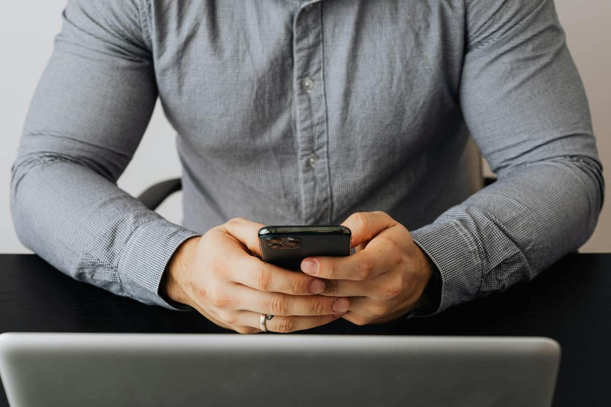 Entrepreneur setting up Telegram channel monetization on their phone