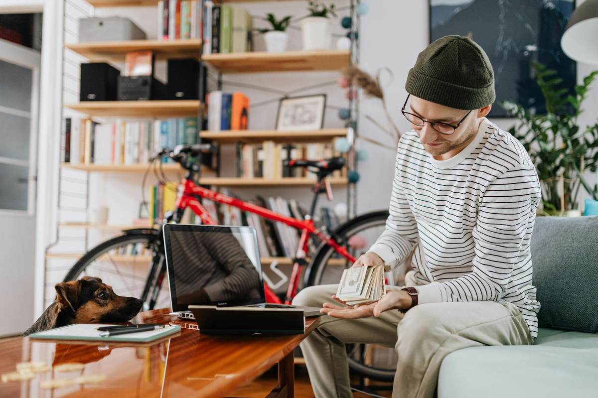 Creator working on laptop analyzing platform fees and community options