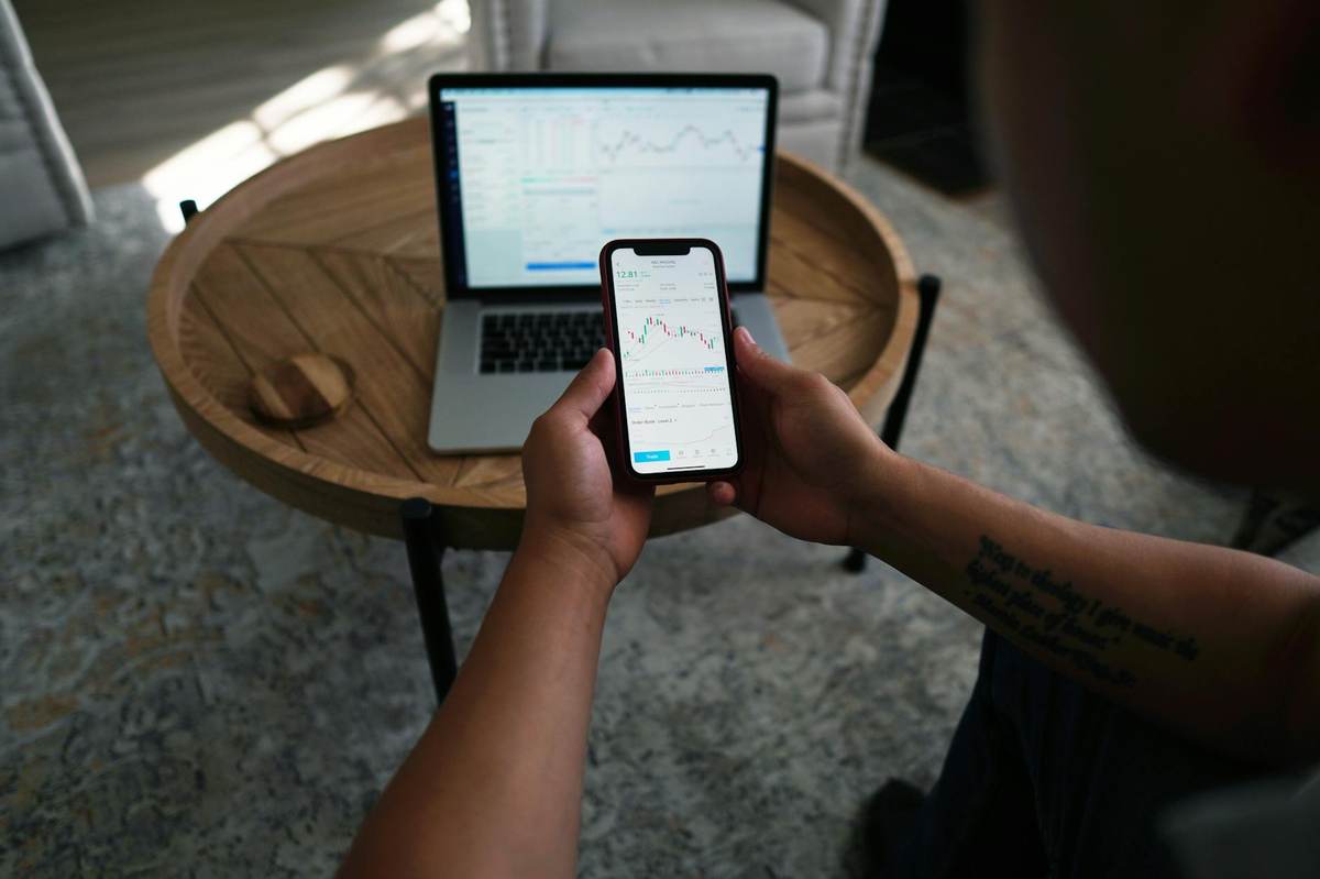 Creator comparing monetization platforms on laptop