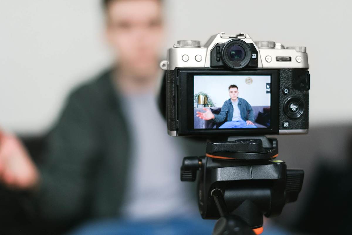 Content creator filming a video tutorial for paid community members