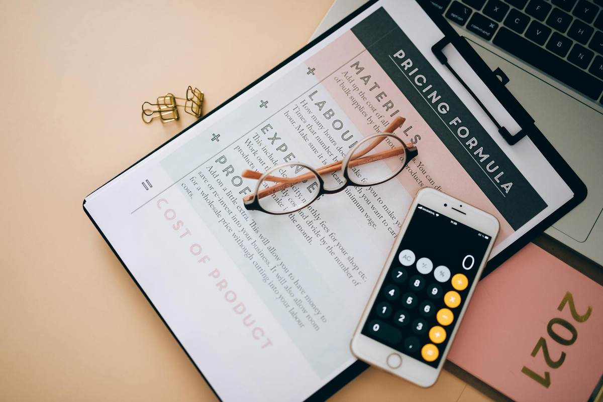 A business professional reviewing pricing comparison options at a desk