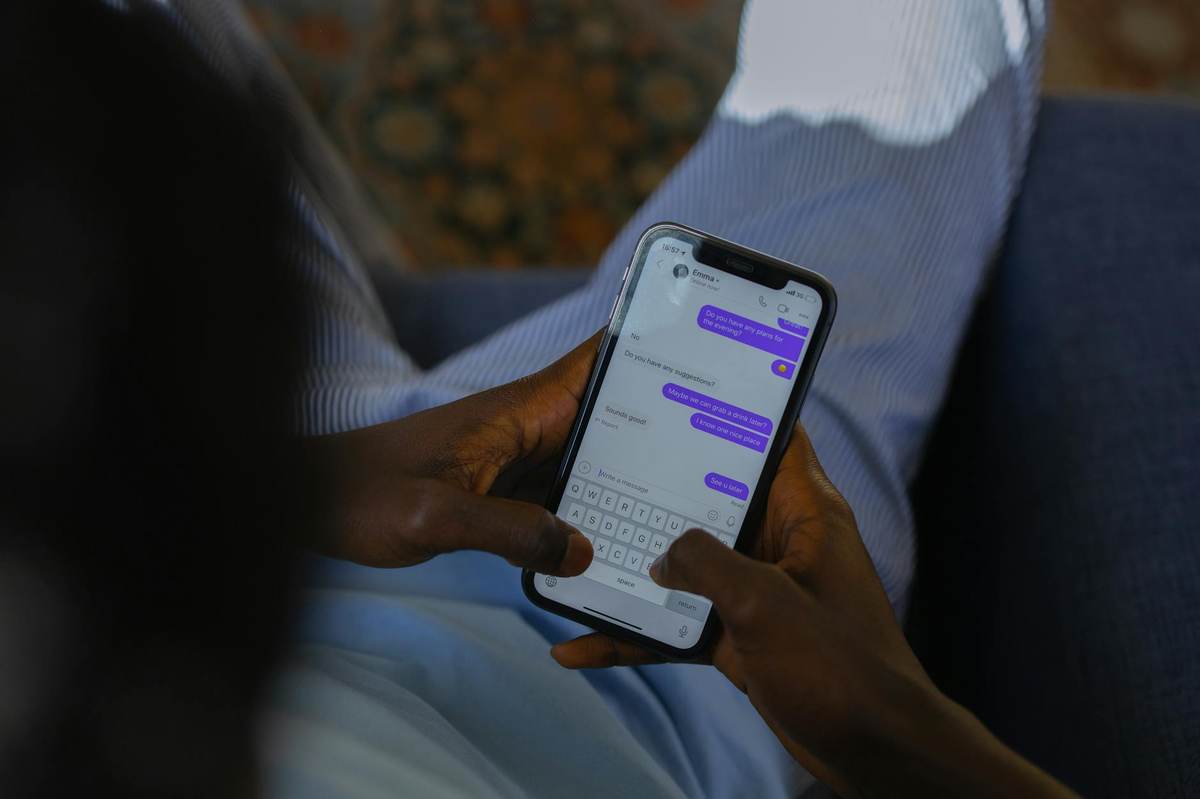 Creator setting up telegram paid messages on phone