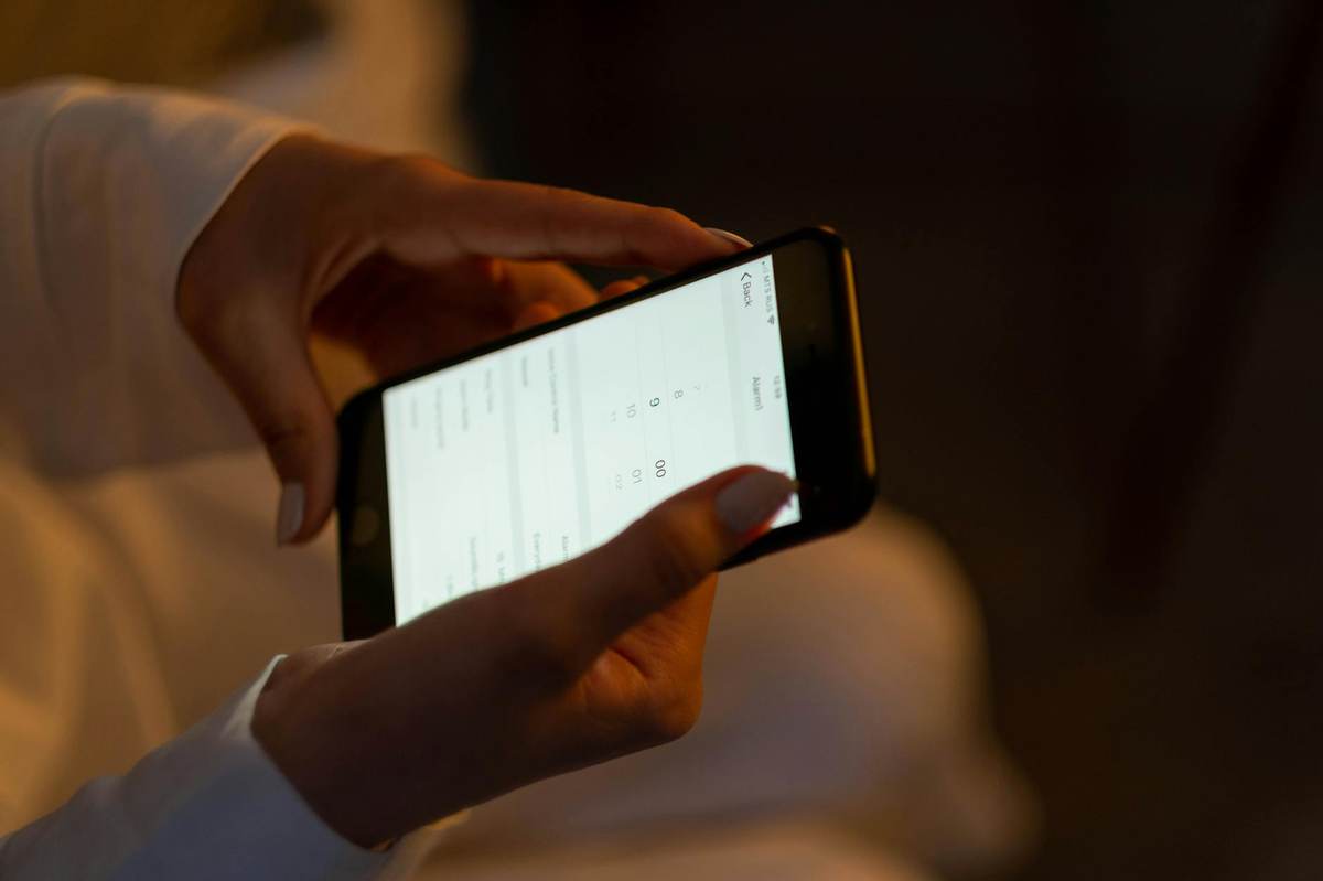 Creator setting up a Telegram paywall on smartphone