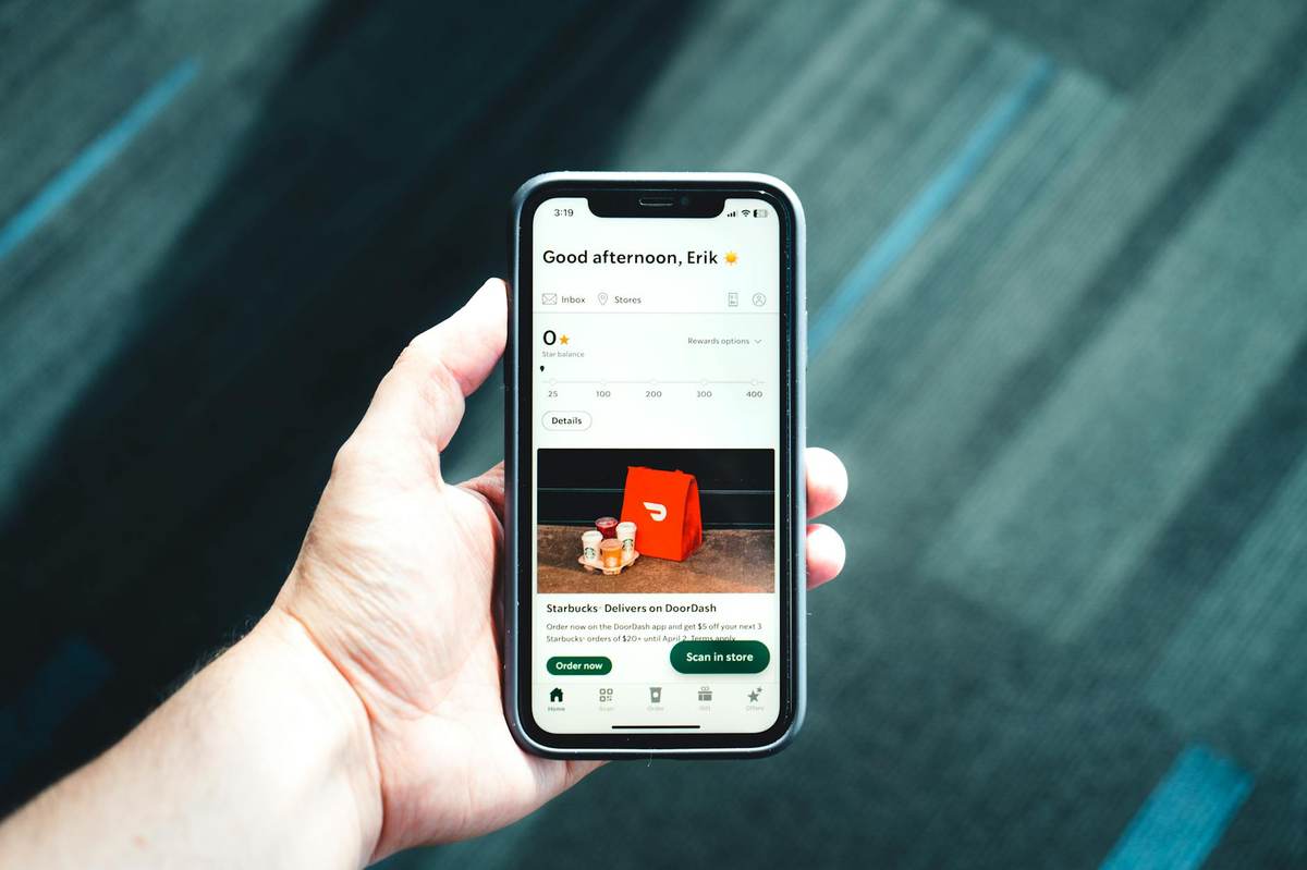 Person using smartphone app to configure subscription settings for a Telegram channel