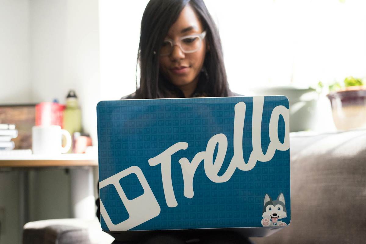 Creator managing paid channel members on laptop for Telegram Stripe integration