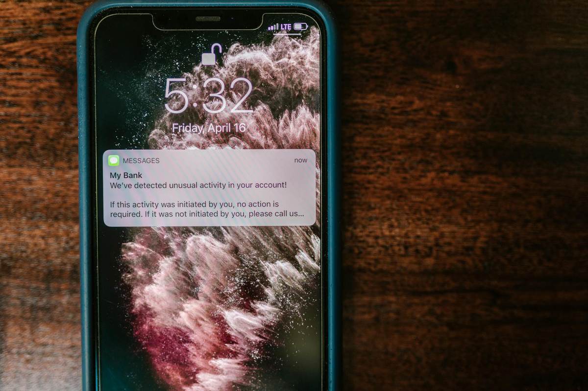 Phone showing high-engagement messaging notifications from a Telegram channel