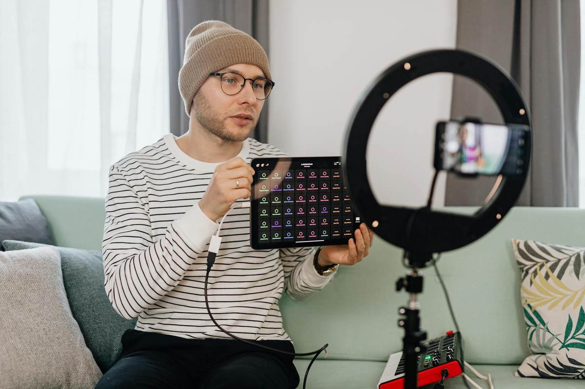UGC content creator filming a product review with professional setup